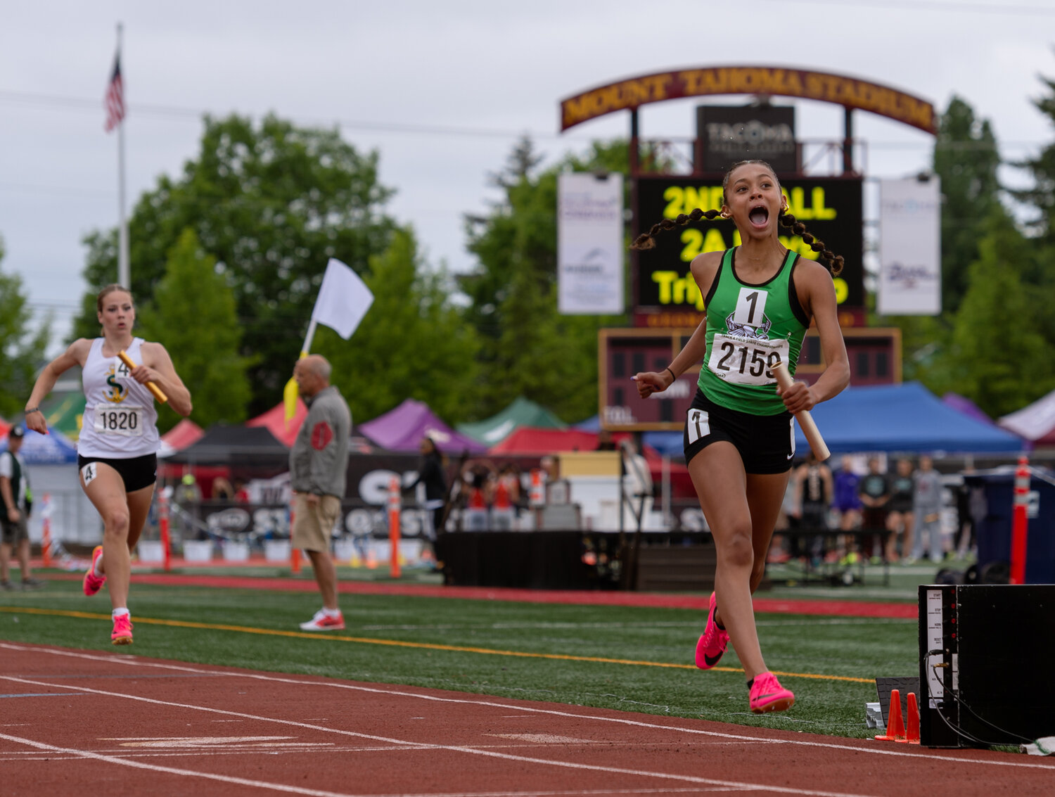 Tumwater’s Ava Jones lets out a scream as she crosses the finish line with a victory in the 2A girls 4x200 relay at the WIAA 2A/3A/4A State Track and Field Championships on Saturday, May 27, 2023, at Mount Tahoma High School in Tacoma. (Joshua Hart/For The Chronicle)
